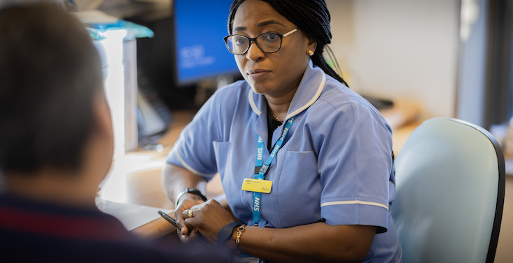 Image shows a healthcare professional at work at Kent & Medway NHS & Social Care Partnership