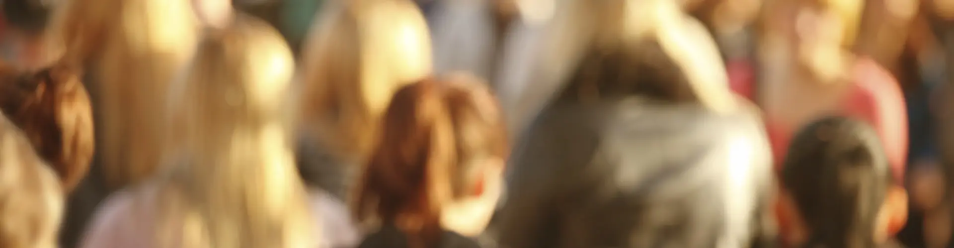 Soft focus view of a crowd of people