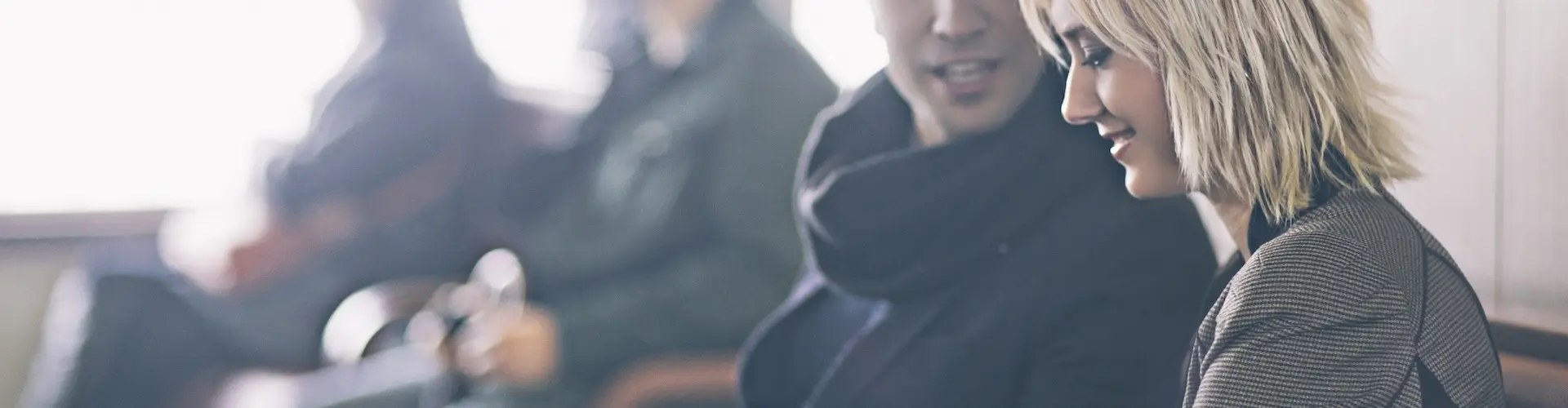 Two people talking in a waiting room