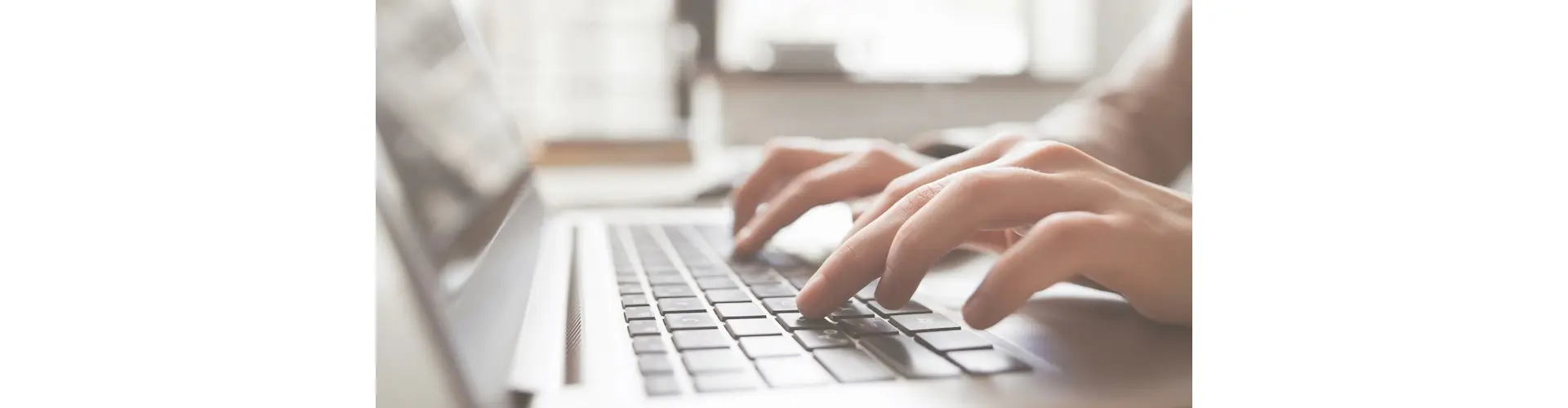 Person typing on a laptop