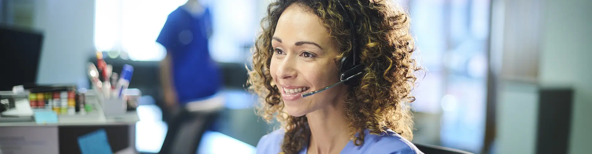 A nurse on the phone in an office