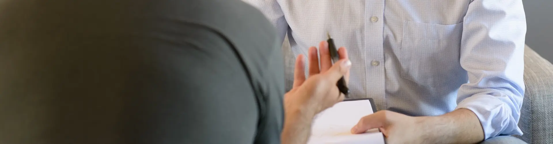 One man interviewing another