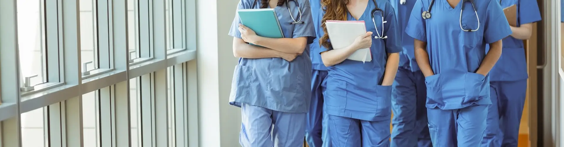 Cropped photo of a group of nurses walking together in a corridor