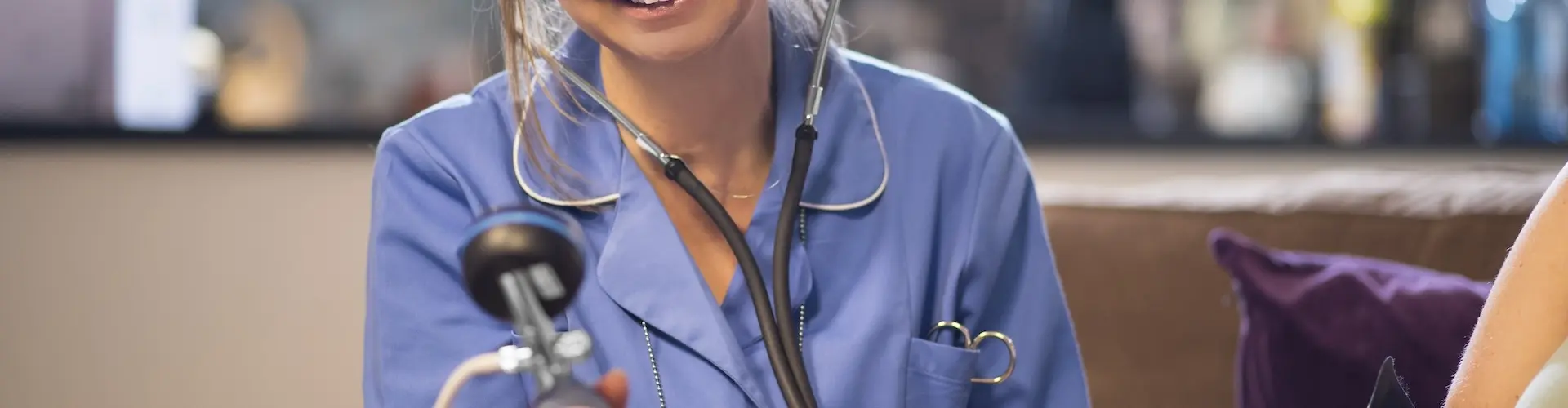 Practice nurse taking a patient's blood pressure