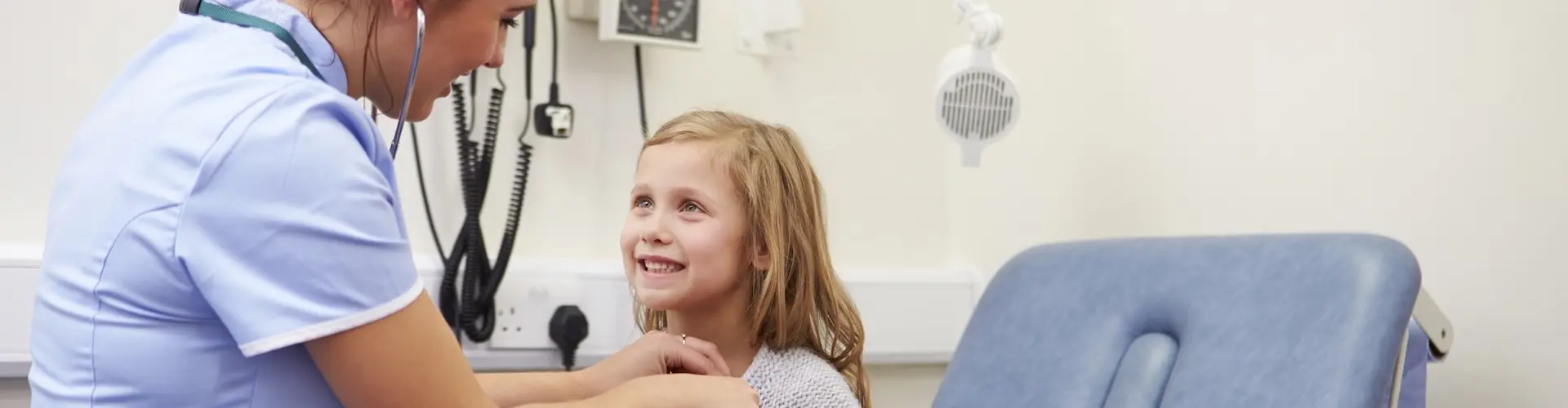Paediatric nurse with child