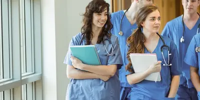 Group of nurses walk and chatting