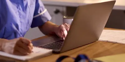 Nurse working on a laptop
