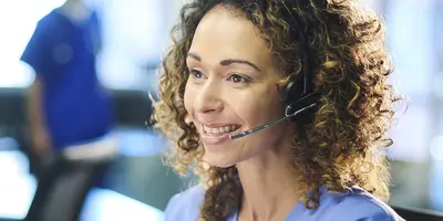 A nurse on the phone in an office
