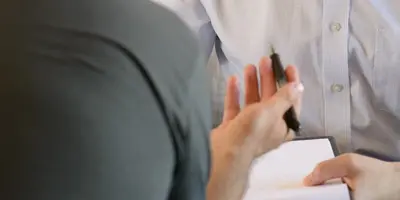 One man interviewing another