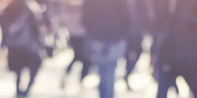 Crowd of people walking in the sun