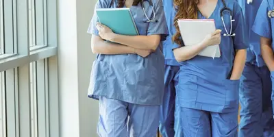 Cropped photo of a group of nurses walking together in a corridor