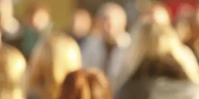 Blurred focus image of a group of people walking