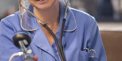 Practice nurse taking a patient's blood pressure