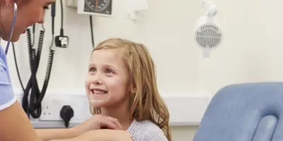 Paediatric nurse with child